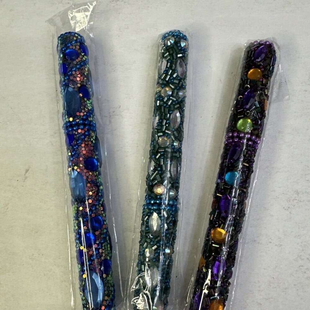 Bedazzled Pens in mostly in blues and purple with ballpoint black ink pen